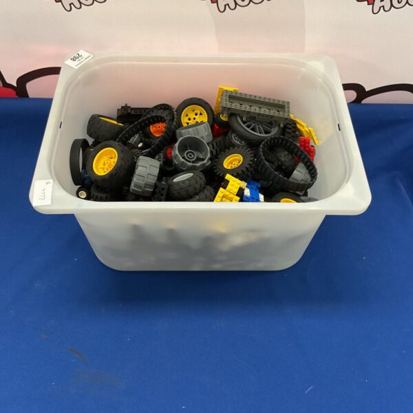 Large lot of assorted Lego wheels and rims for building.