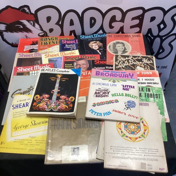 Vintage sheet music collection featuring Beatles guitar edition.