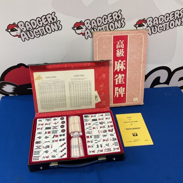 Vintage HP Gibson mahjong set with rule book and tiles.