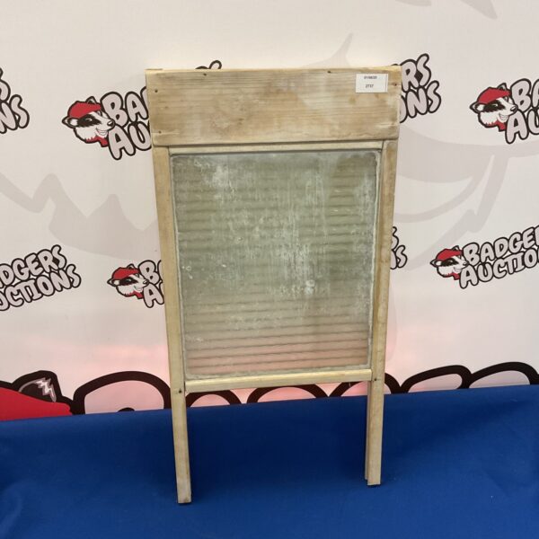 Vintage glass and wooden washboard for laundry.