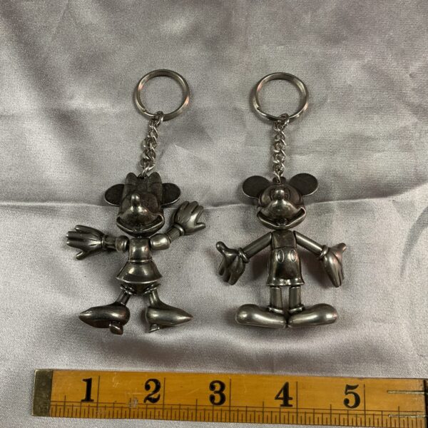 Silver Disney Mickey and Minnie Mouse articulated keyrings, vintage collectible.