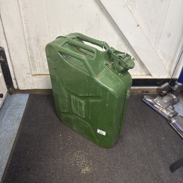 Vintage green metal jerry can, classic fuel container.
