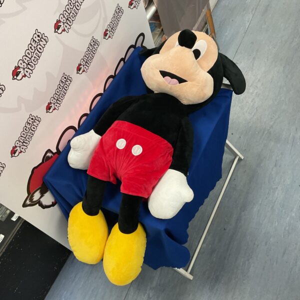 Large vintage Mickey Mouse plush toy, a classic Disney collectible.