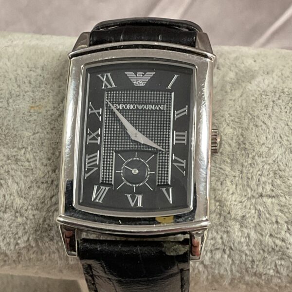 Vintage Emporio Armani watch with leather strap and rectangular case.