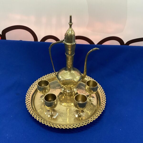 Detailed Moroccan coffee set on a decorative tray.