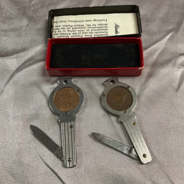 Pair of vintage Farthing penknives with coin handles.