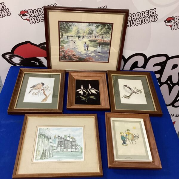 Vintage landscape artwork in a decorative frame for wall display.
