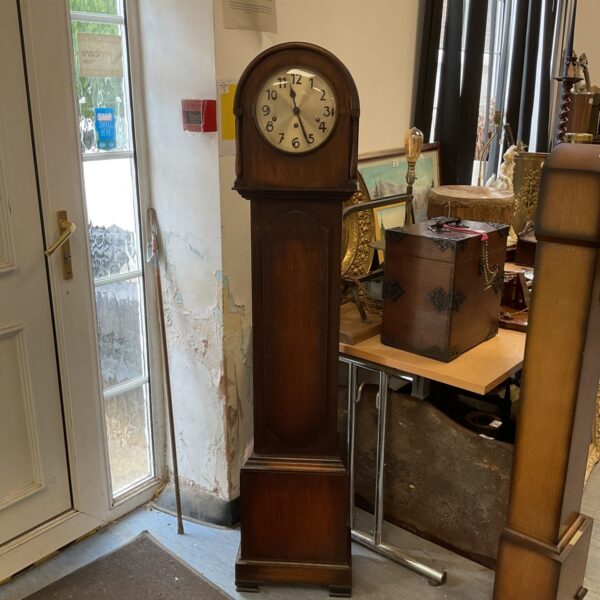 Vintage mid-century granddaughter clock in a room setting.