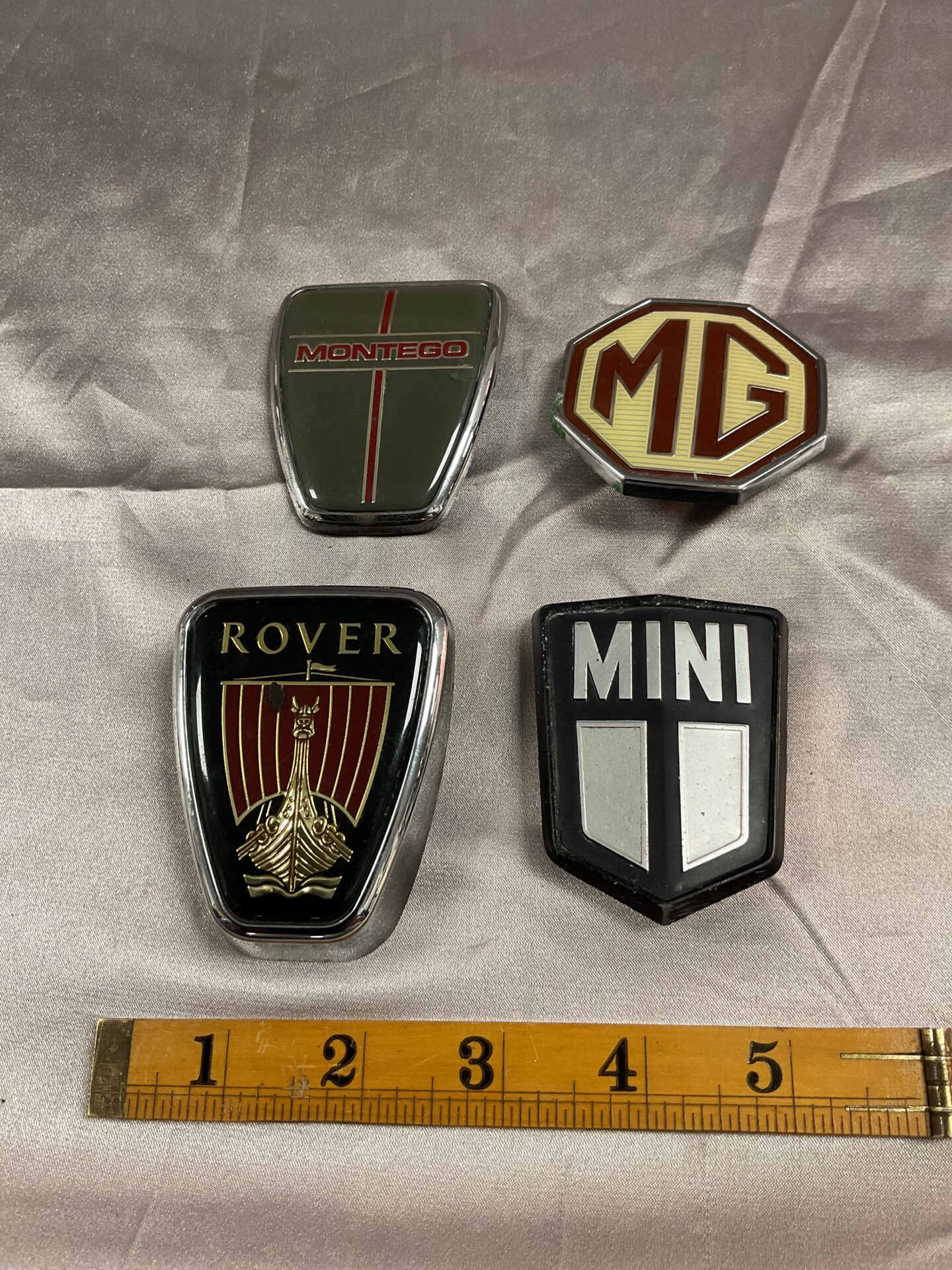 715 Four car badges Rover Mg Mini and Montego