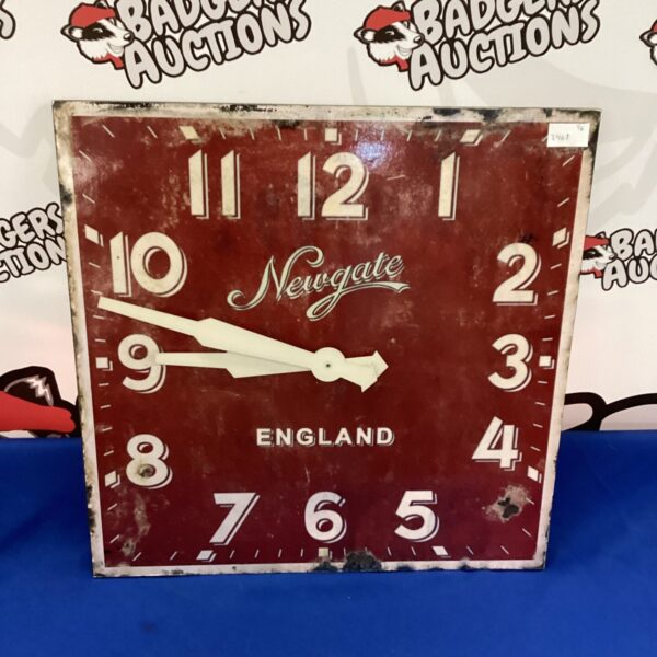 Reproduction Newgate Station clock with bold black numerals.