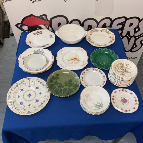 Vintage porcelain plate collection featuring Wedgwood and Myott designs.