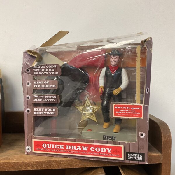 Vintage Quick Draw Cody alarm clock, cowboy themed novelty clock.