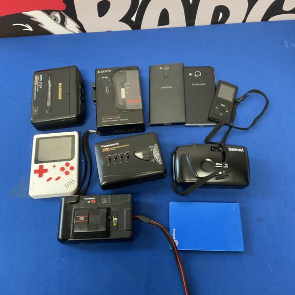 Vintage lot of cassette walkmans and cameras, including Sony and Hanimex.