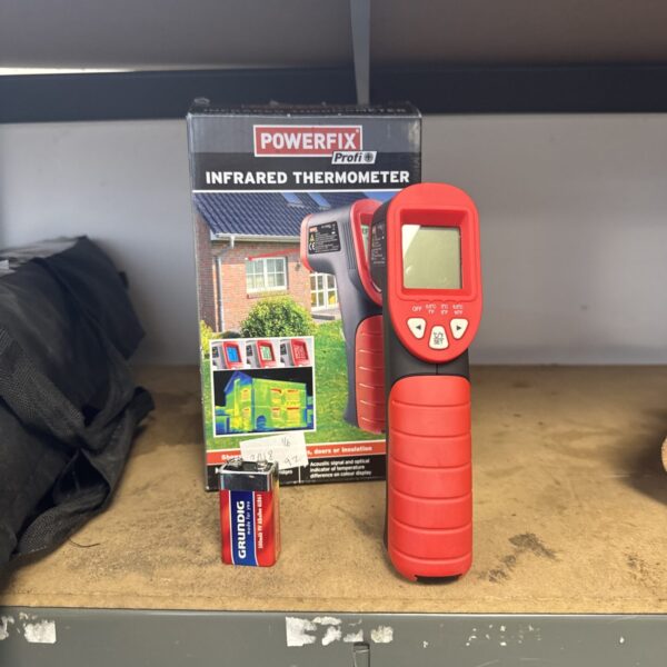 Front view of a Powerfix infrared thermometer with digital display.