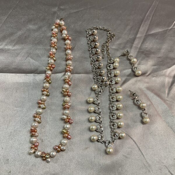 Vintage pearl necklace and earring set with silver clasp.
