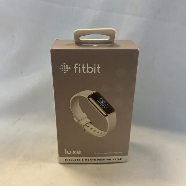 Fitbit Luxe fitness tracker on a neutral background.