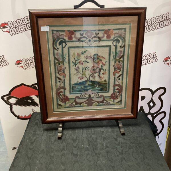 Antique Victorian tapestry fire screen with a floral landscape.