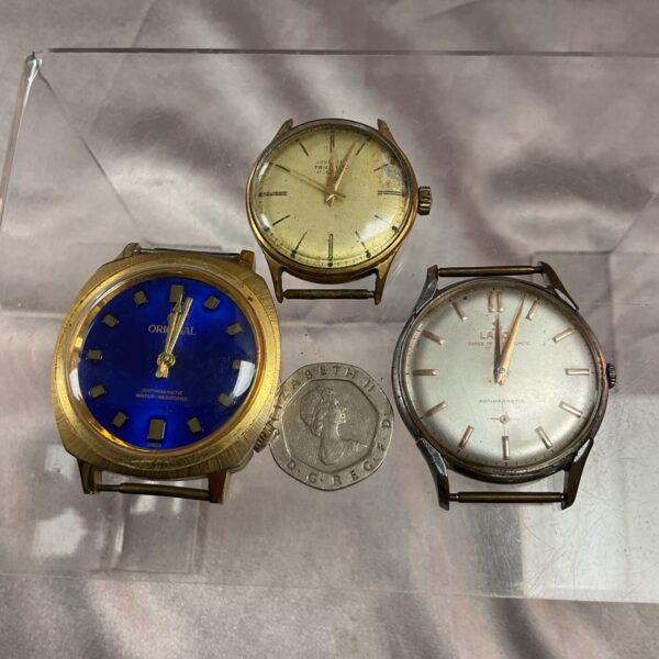 Vintage mechanical watches lot featuring a Junghans Trilastic.