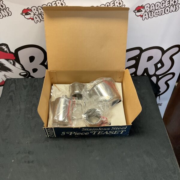 New stainless steel teaset in original packaging, ready for use.