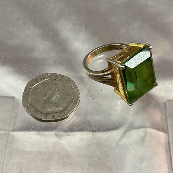 Chunky silver ring with large green stone, size N.