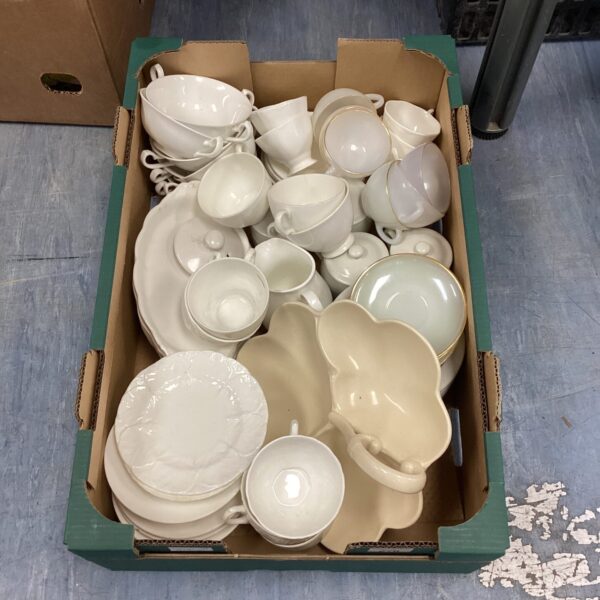 White porcelain tableware lot with plates, cups, and saucers.