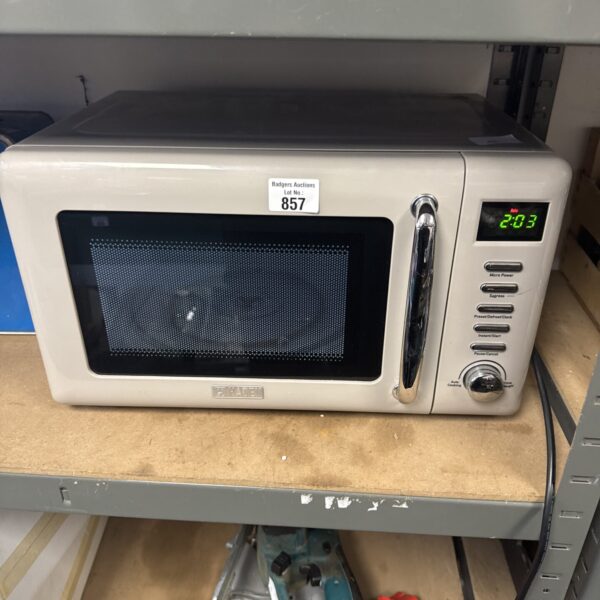 White Haden microwave oven with control panel visible.