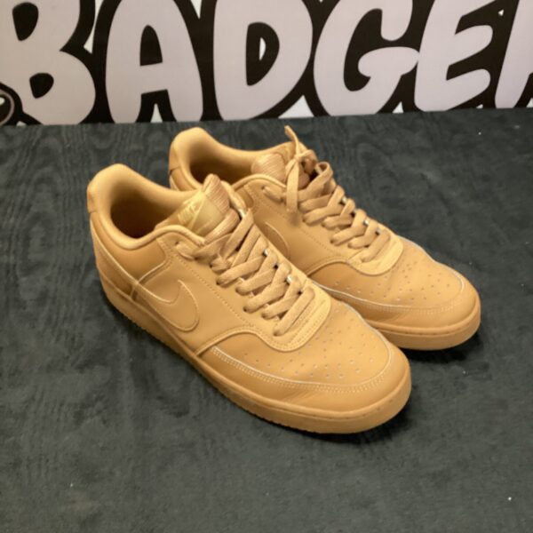 Beige Nike Air Force One trainers size 9.5 for casual wear.
