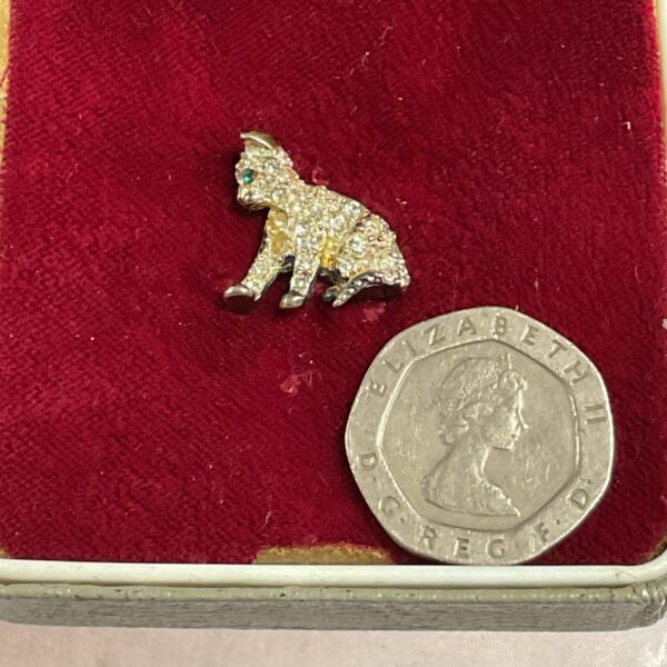 Sparkling vintage cat tie stud with rhinestones, a collectible jewellery piece.