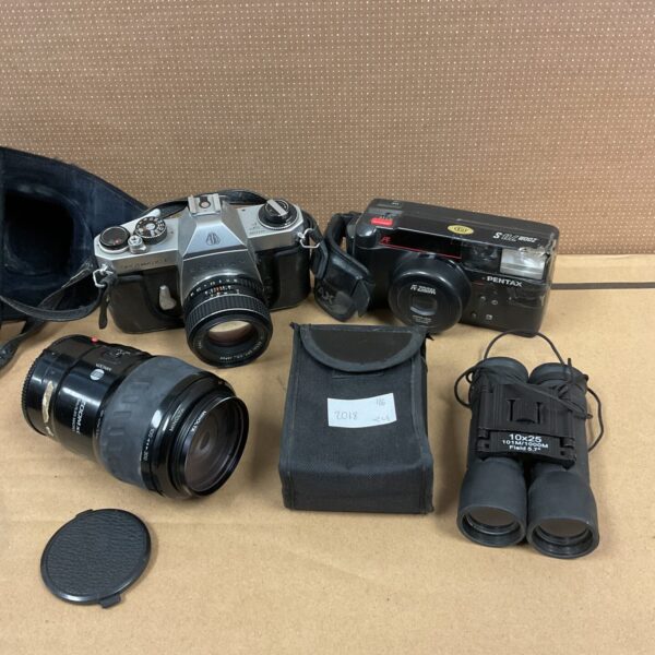 Vintage Pentax Sportmatic camera with lenses and binoculars.