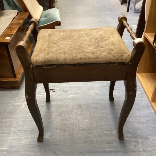 Antique piano stool with sheet music compartment, Victorian style.