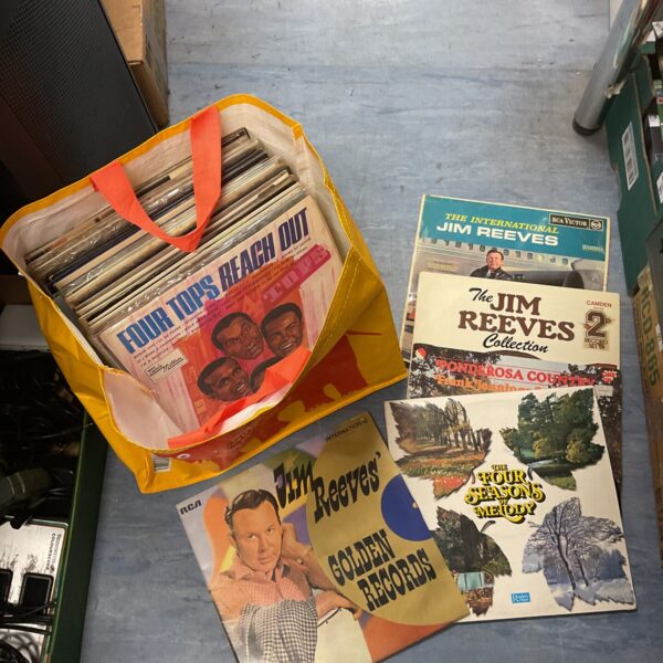 Vintage vinyl record lot in a carrying case.