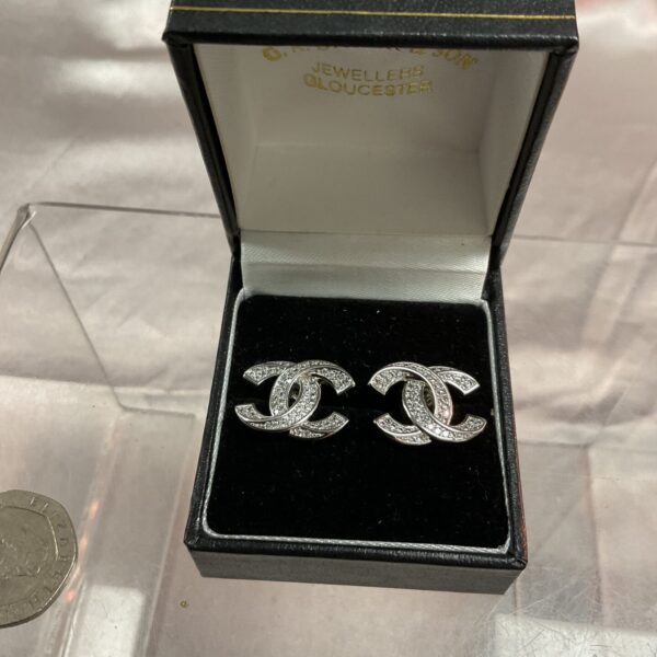 Vintage Chanel silver 925 earrings with interlocking CC motif.