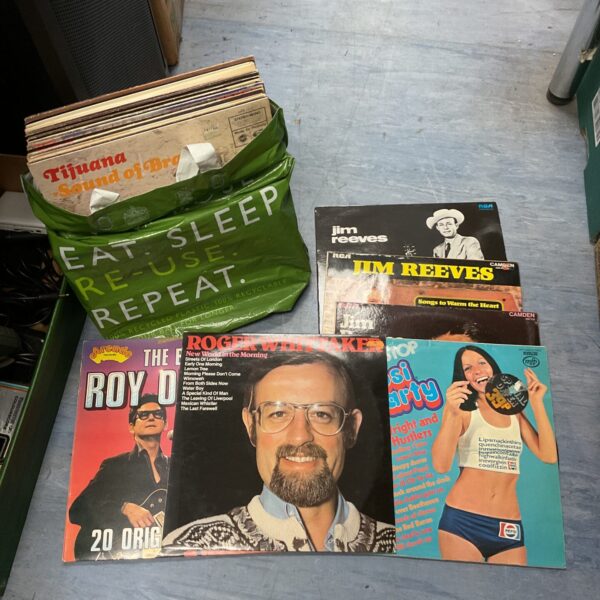Overview of a lot of vintage vinyl records for sale.