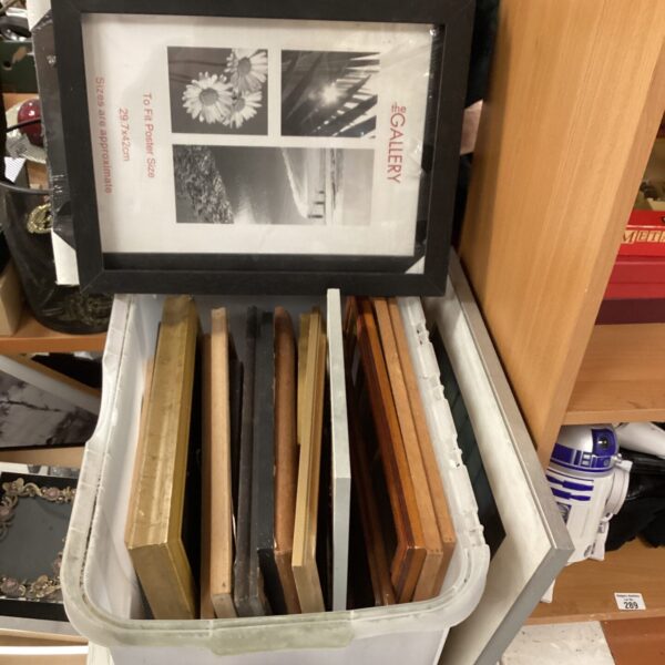 Bulk lot of wooden picture frames, mixed sizes and styles.