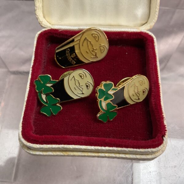 Vintage lot of three Guinness advertising badges for collectors.