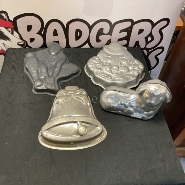 Vintage set of four metal cake tins for baking.