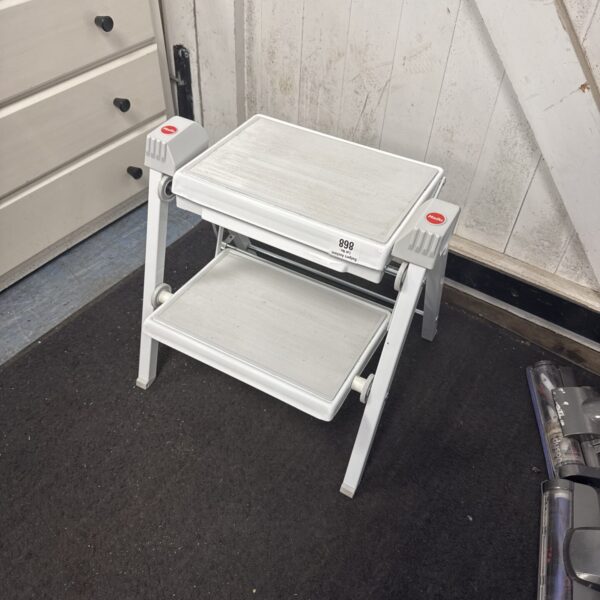 Compact hailo folding step stool for household use.