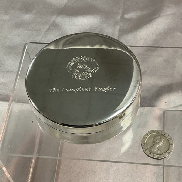 Antique silver trinket pot with engraved lid.