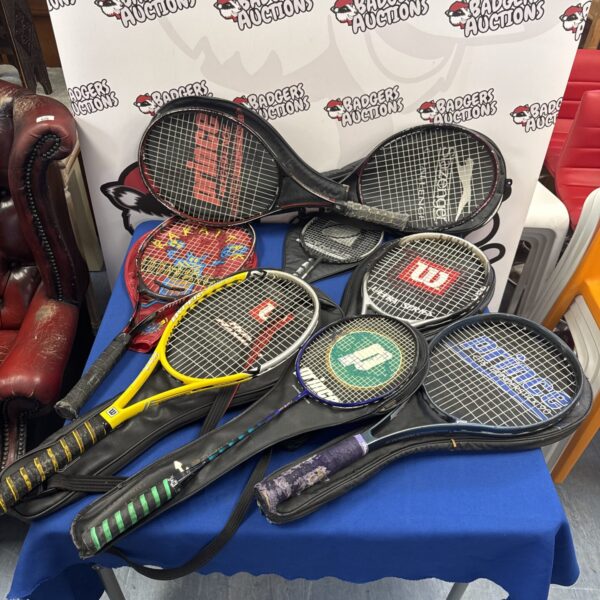 Collection of vintage tennis and badminton rackets for sports enthusiasts.