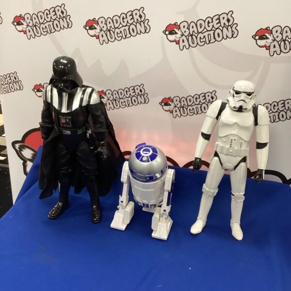 Vintage Star Wars figures including Darth Vader and R2-D2.