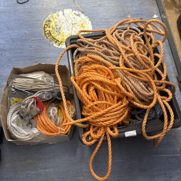 Assorted ropes and a pulley in a lot for sale.