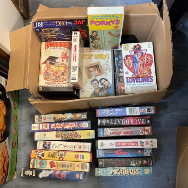 Vintage VHS movie cassette collection, retro home video tapes.