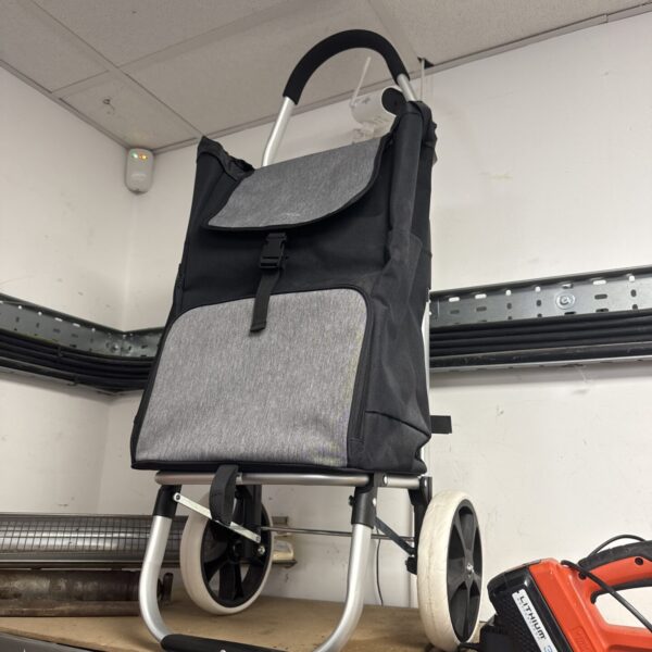 Grey inatreck folding shopping trolley with wheels.