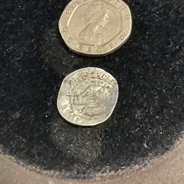 Silver groat coin featuring the portrait of Richard III.