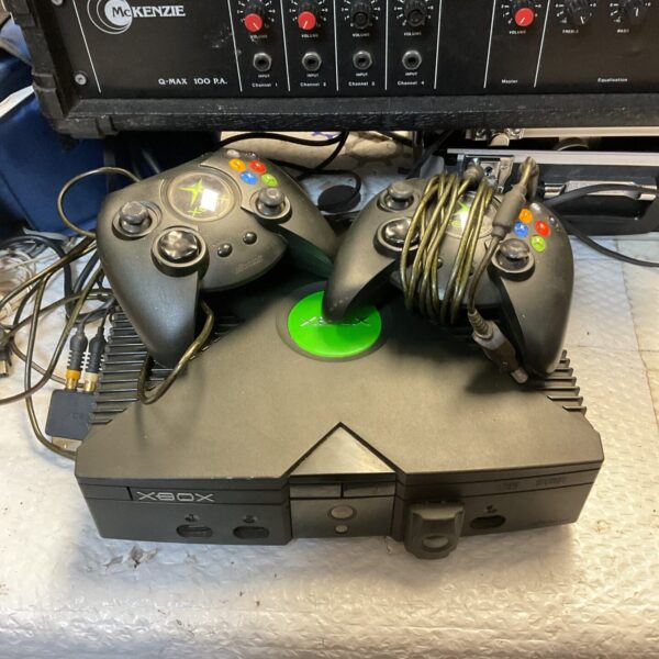 Original Microsoft Xbox console with two controllers for retro gaming.