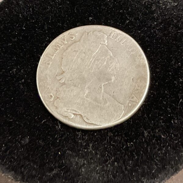 Antique silver halfcrown featuring the portrait of William III.