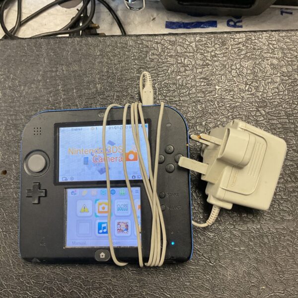 Front view of a used Nintendo 2DS handheld gaming console.
