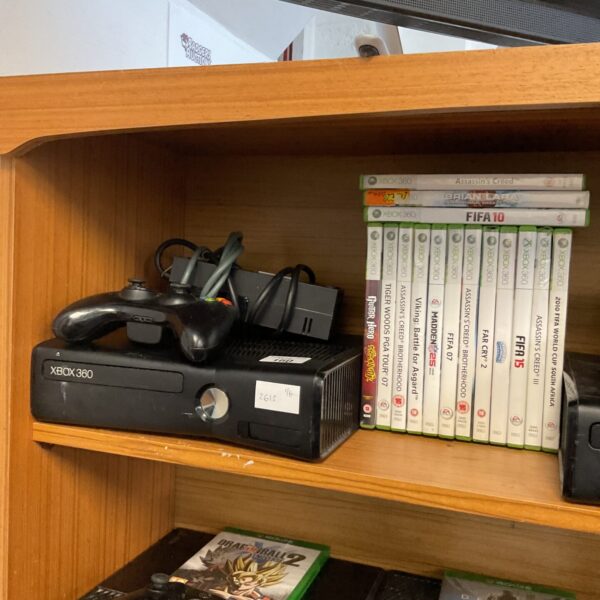 Xbox 360 console bundle with various video game titles.