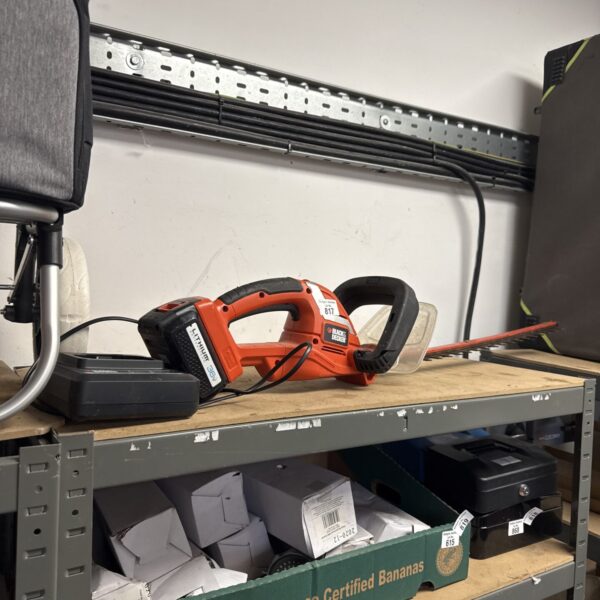 Black & Decker cordless hedge cutter in untested condition.
