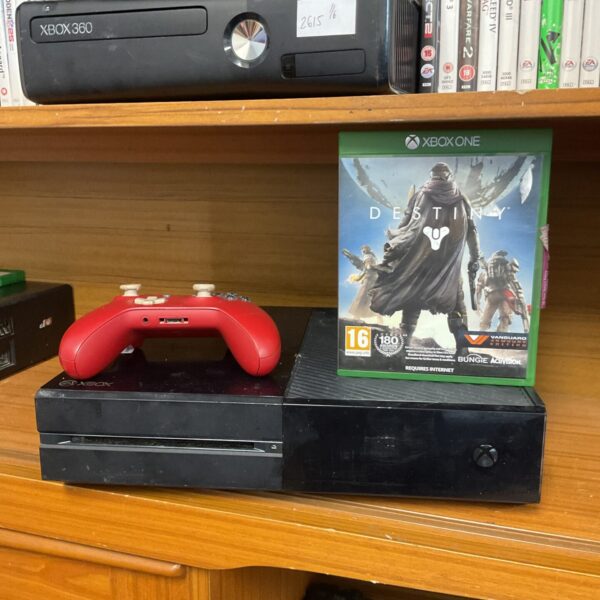 Xbox One console with controller and game presented for auction.